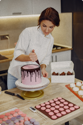 Baker preparing cake